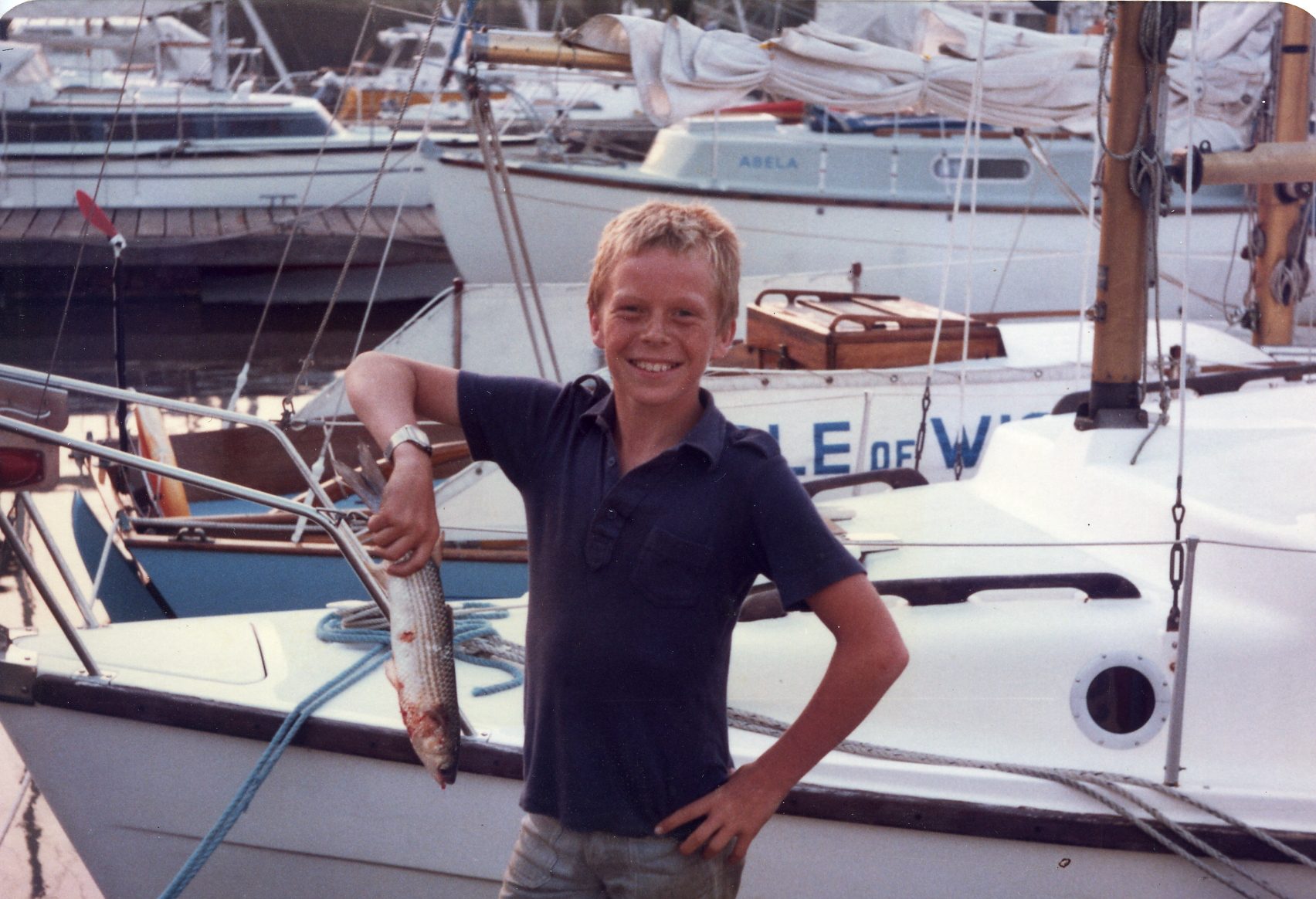 Jason as a boy, out on the water — a lifelong love of boats